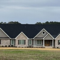 Tinted window residential home with open yard